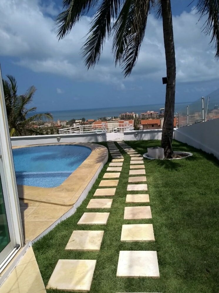 Фото Vacation Home EN Porto das Dunas