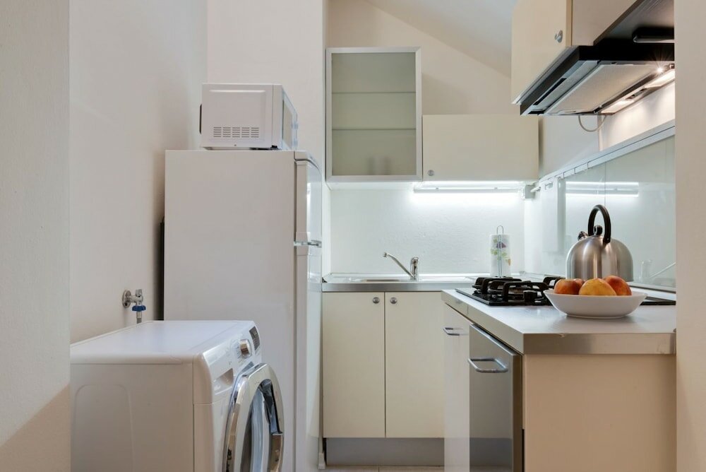 Фото VIA Santo Stefano Secret Garden Apartment