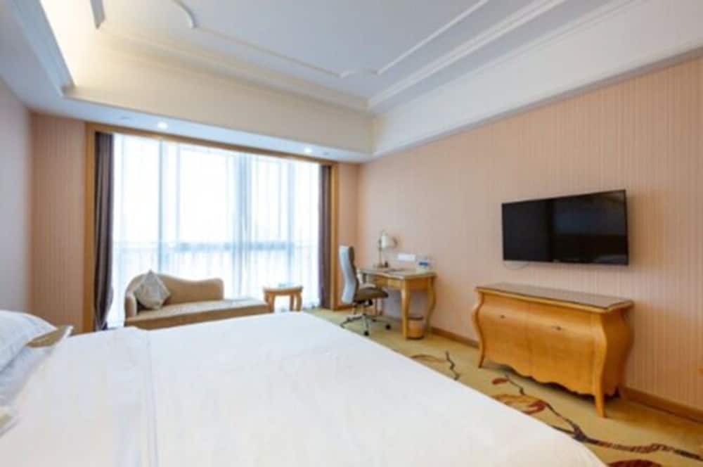 Фото Vienna International Hotel - Ningbo City West Xintiandi