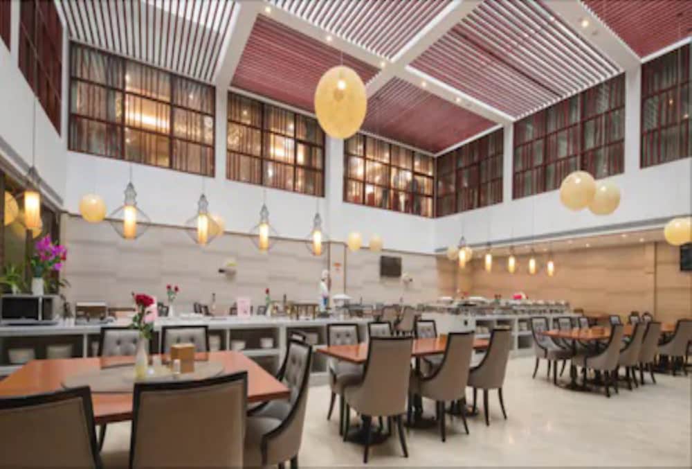 Фото Auden International Hotel