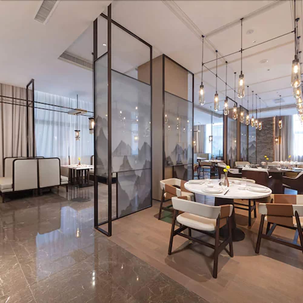 Фото New Century Hotel Zhenhai