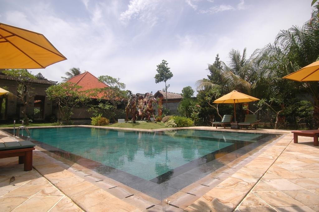 Фото Puri Rai Hotel