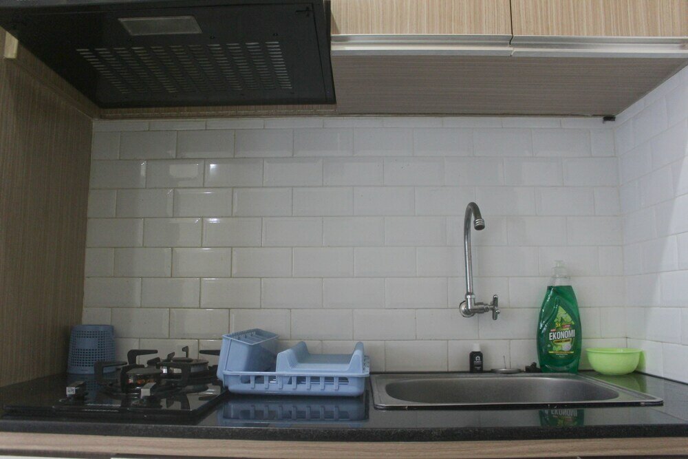 Фото Simple And Homey 2Br Apartment At Grand Asia Afrika