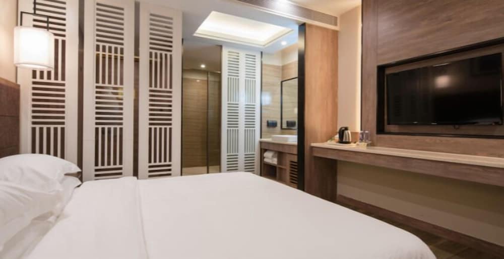 Фото Auden International Hotel