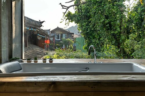 Гостиница Lijiang Hotel JunPoXuan в Лицзяне