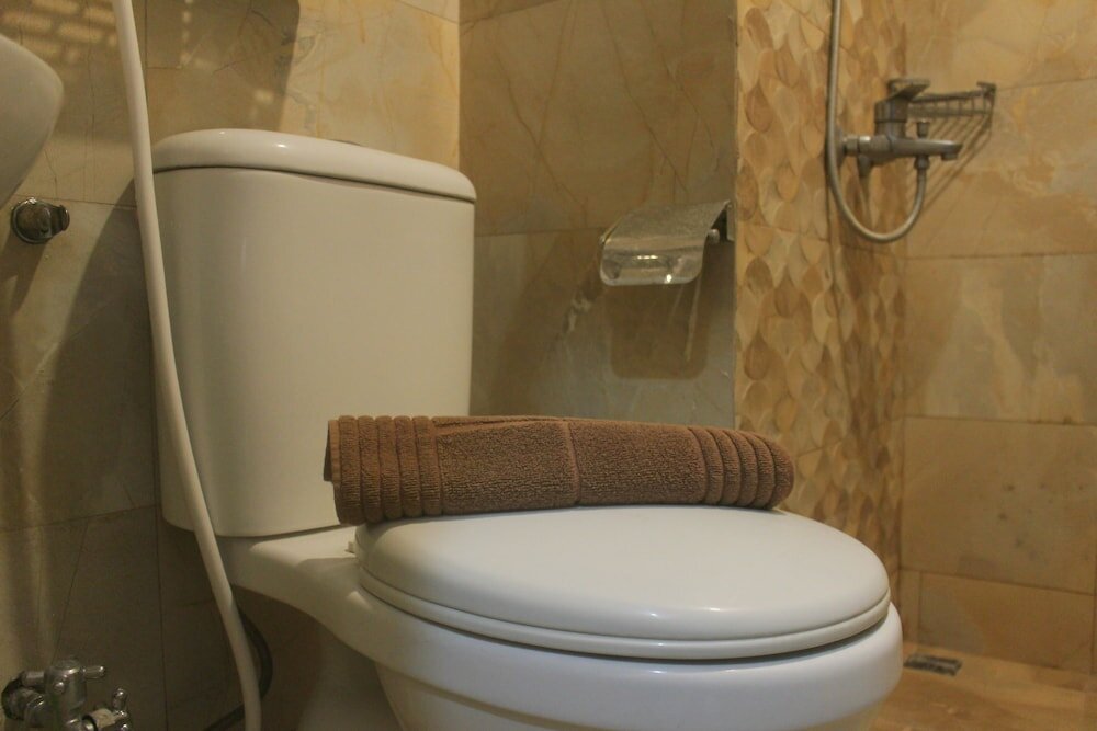 Фото Simple And Homey 2Br Apartment At Grand Asia Afrika