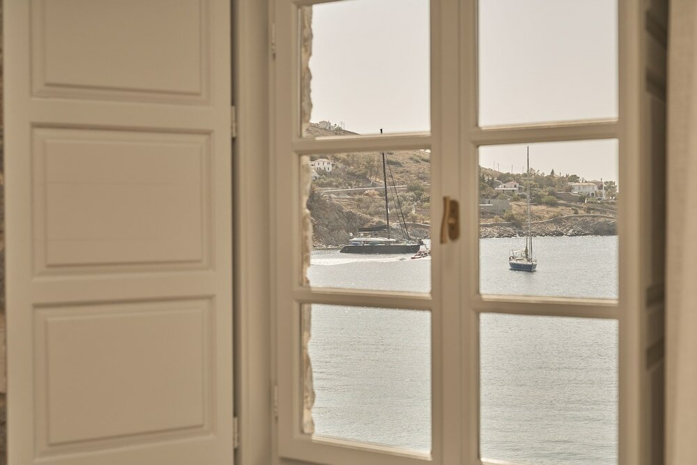 Фото Mandraki Beach Resort - Adults Only