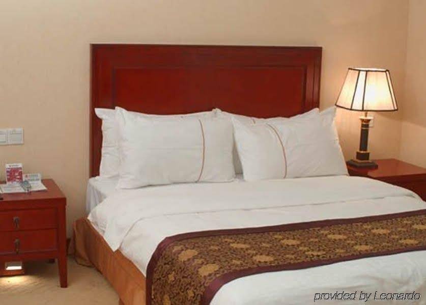 Фото Yashidu Suites Hotel