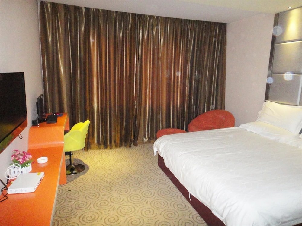 Фото Linhai Aishang Business Hotel