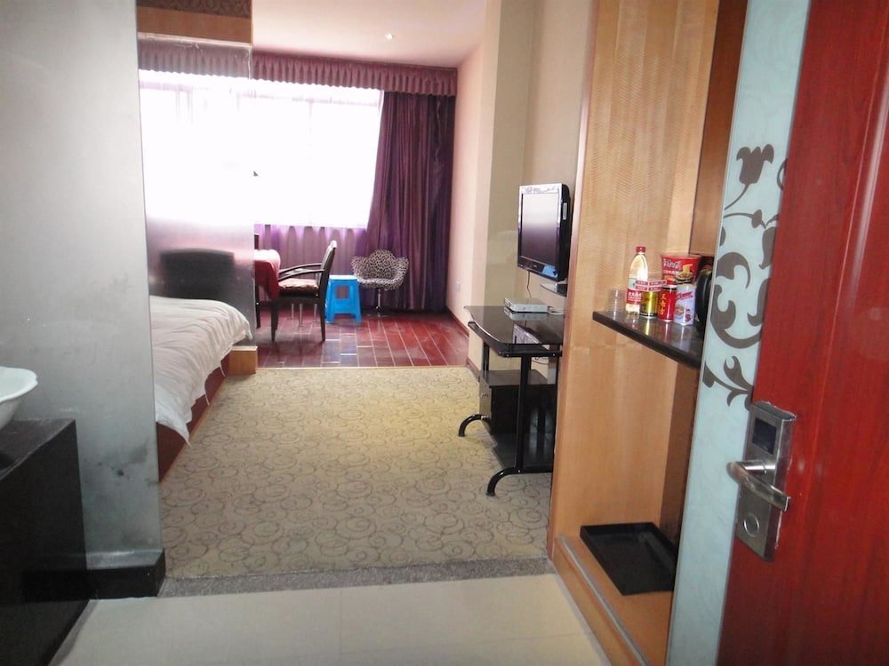 Фото Linhai Aishang Business Hotel