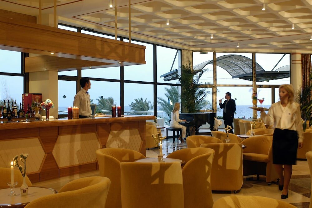 Фото Constantinou Bros Athena Royal Beach Hotel