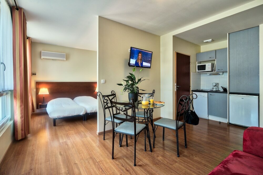 Фото Zenitude Hôtel - Résidences Les Jardins de Lourdes