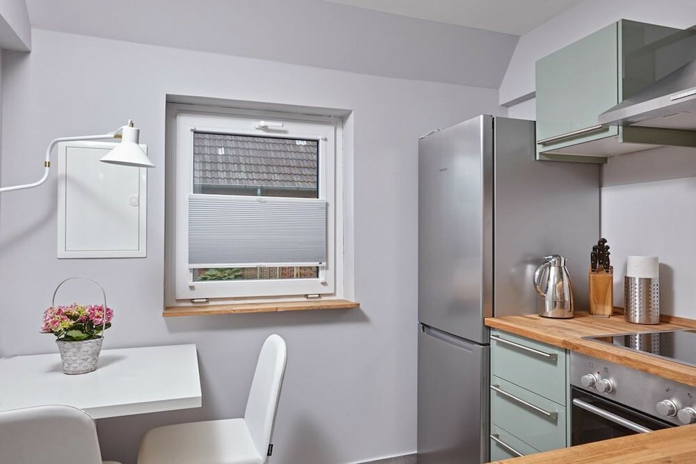 Фото Ferienhaus & Appartments Düneneck 8