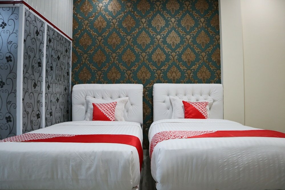 Фото Oyo 1648 Penginapan Three Joye