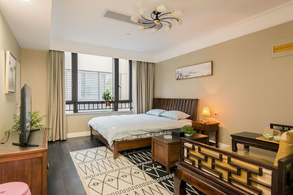 Фото Shanghai Xinchuan Boutique Apartment