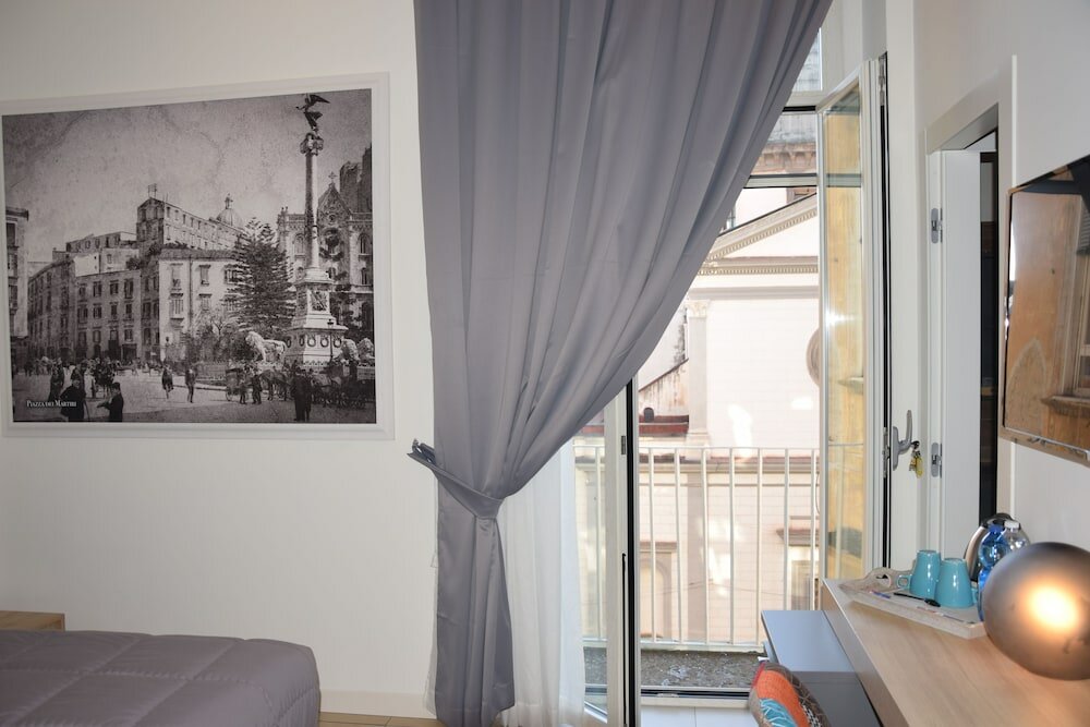 Фото Napoli Squares Suites