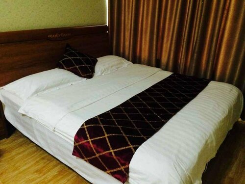 Гостиница Wanda Gold Dragon Holiday Apartment в Циндао