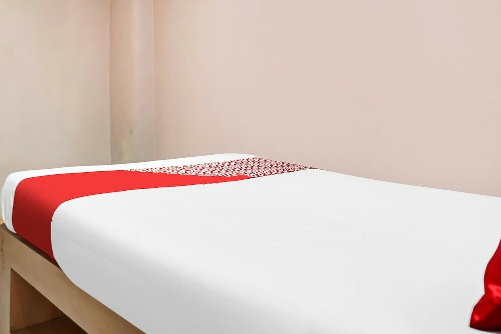 Фото Spot On 91336 Guesthouse Tarumanegara