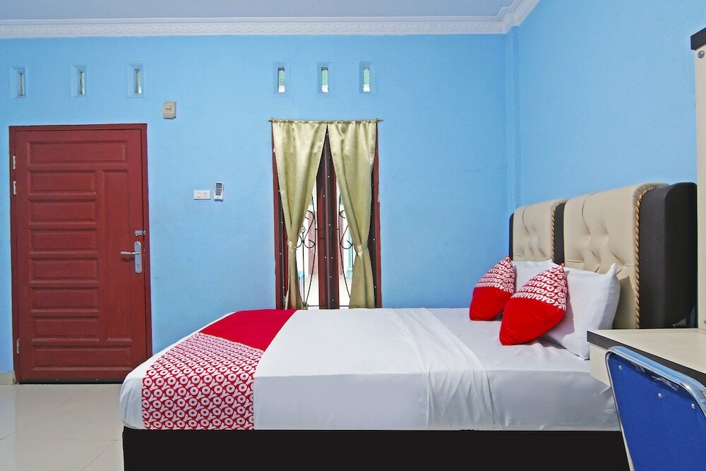 Фото Oyo 90752 Ridho Guest House Syariah