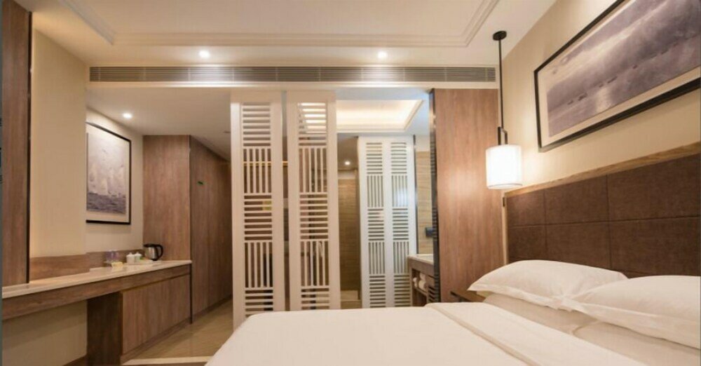 Фото Auden International Hotel