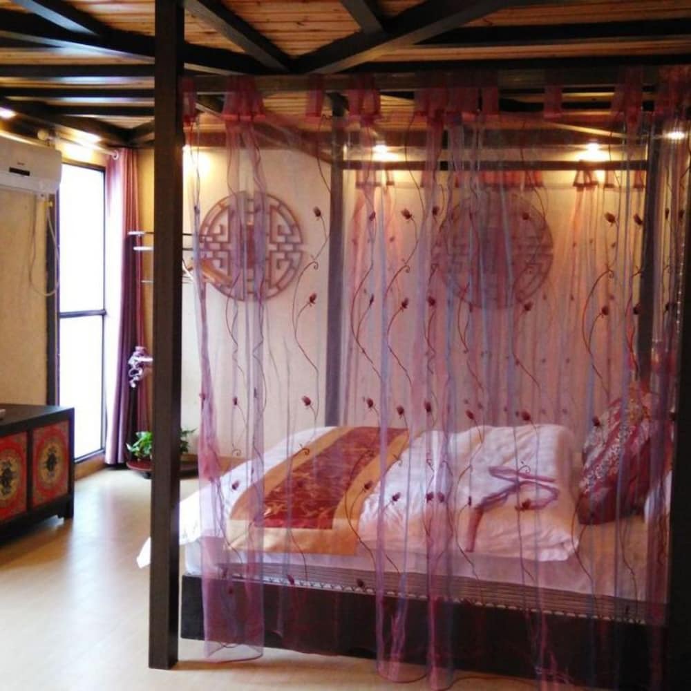 Фото Fenghuang Nanmu Inn No. 1