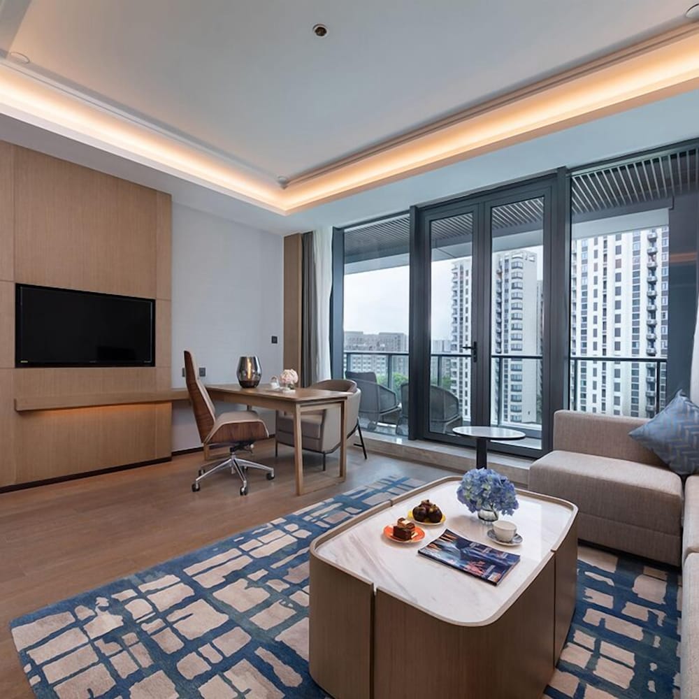 Фото New Century Hotel Zhenhai