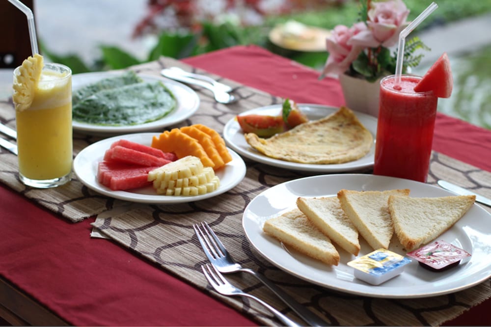 Фото Putri Ayu Cottages