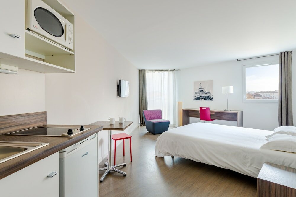 Фото Hévéa Appart Hôtel