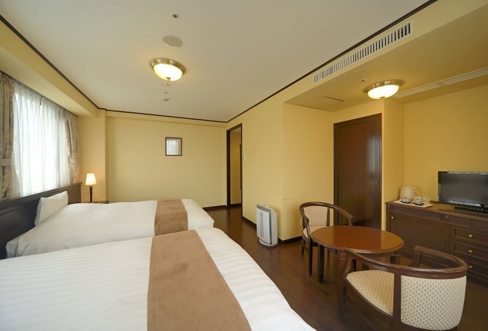 Фото Amami Sunplaza Hotel