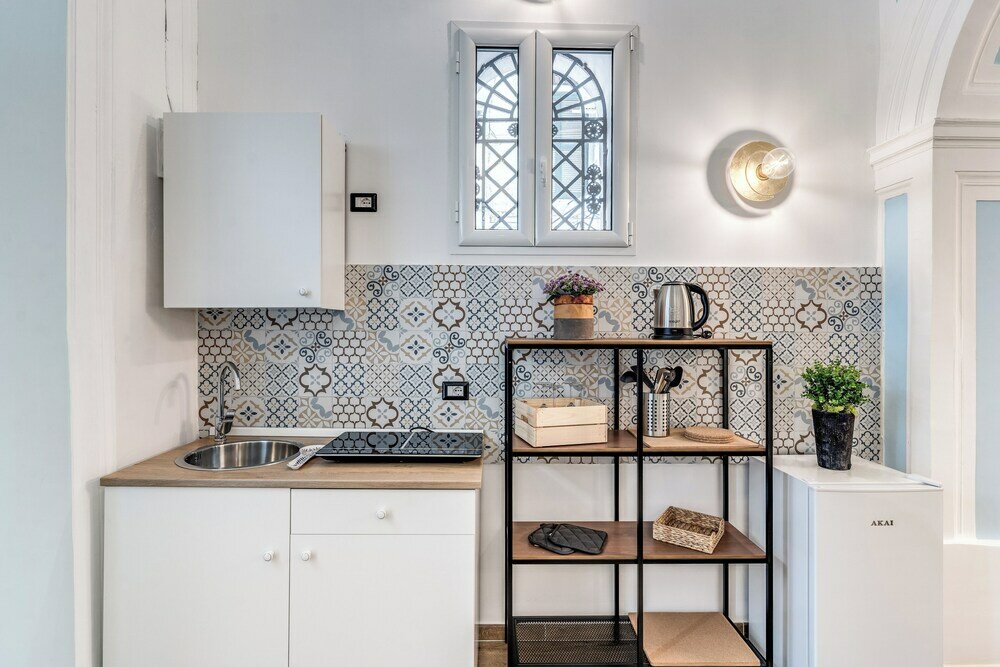 Фото The Quarters Naples Apartment