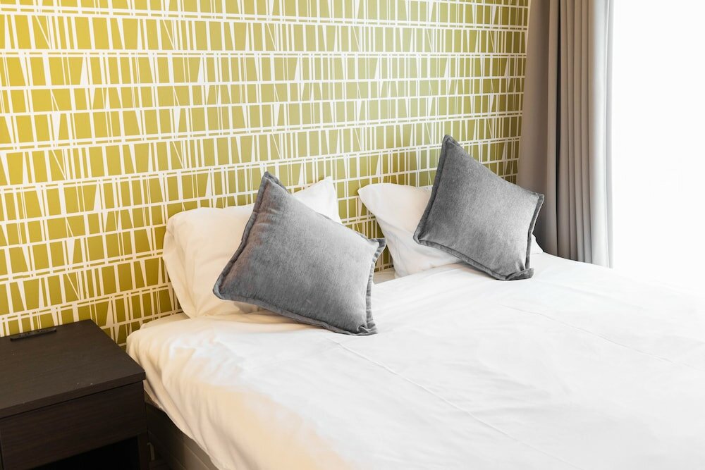 Фото Shinsaibash East Nana Apartment · Junan