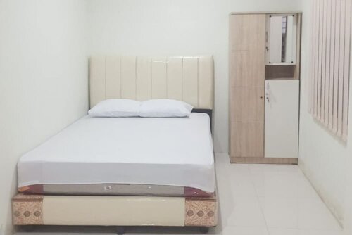 Гостиница KoolKost near Universitas Pembangunan Panca Budi Medan в Медане