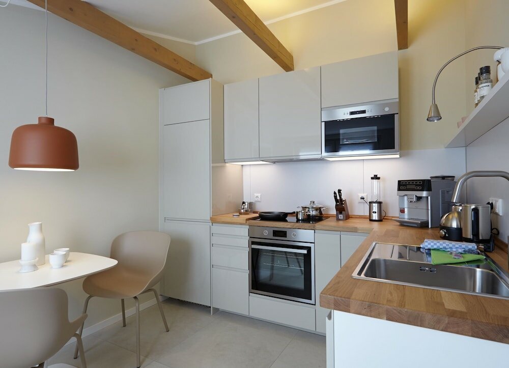 Фото Ferienhaus & Appartments Düneneck 8