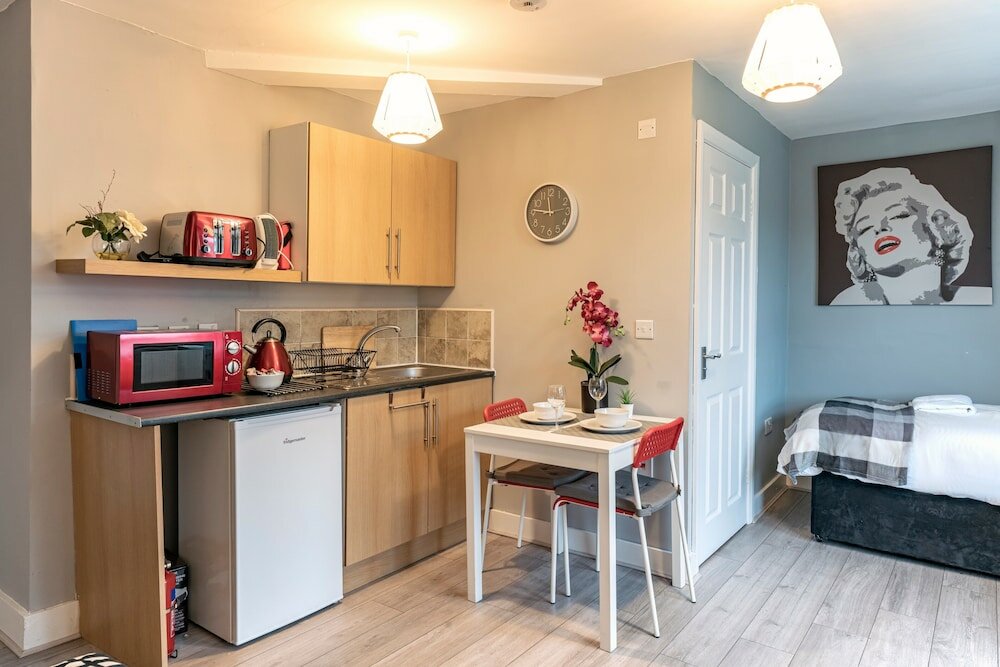 Фото Grey Stone Studio Apartments