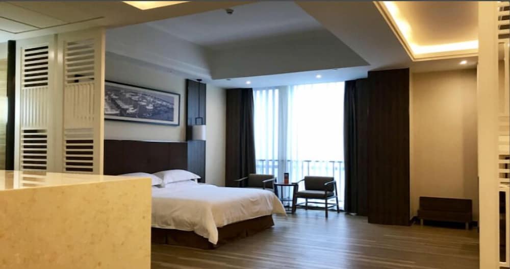 Фото Auden International Hotel