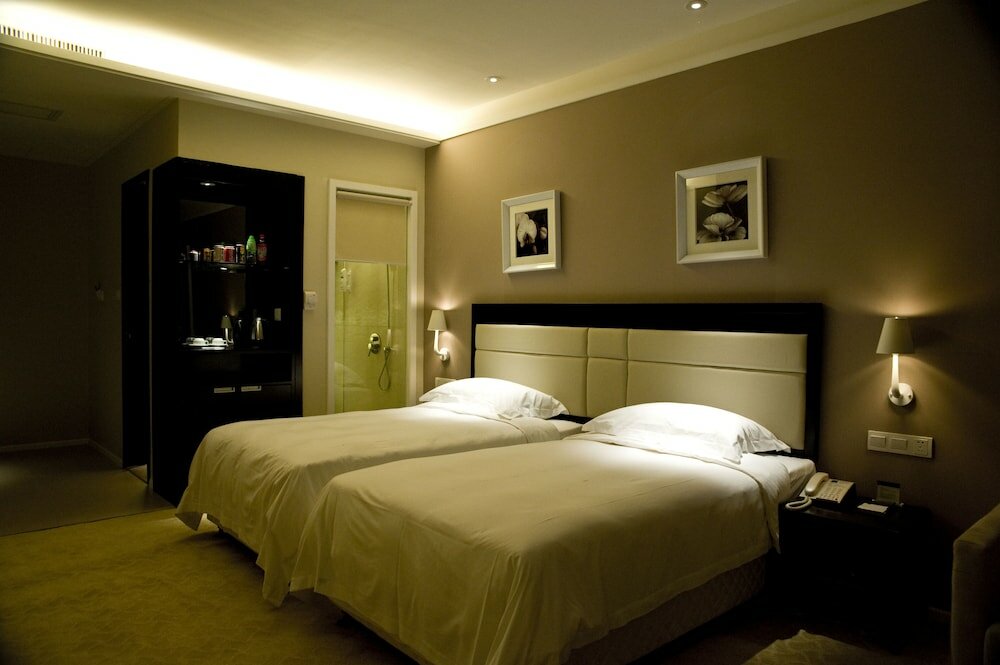 Фото KaiMan Hotel