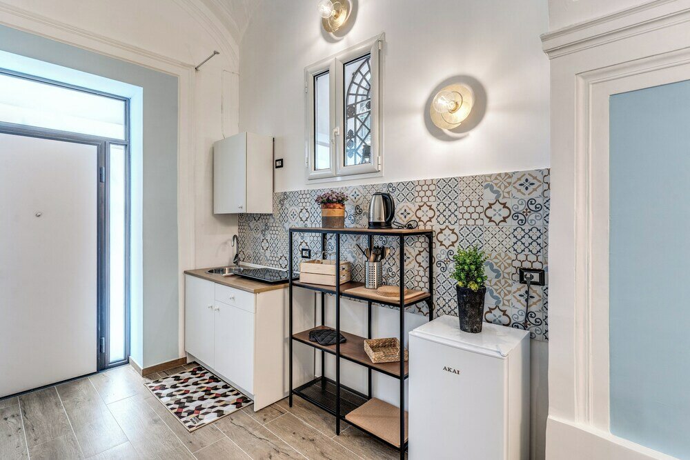 Фото The Quarters Naples Apartment