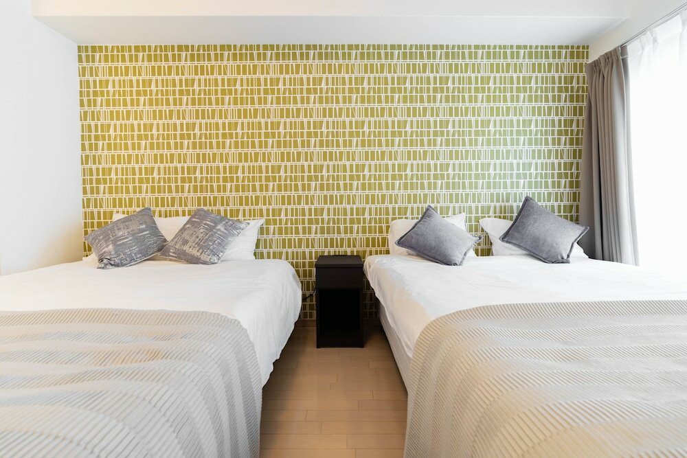 Фото Shinsaibash East Nana Apartment · Junan