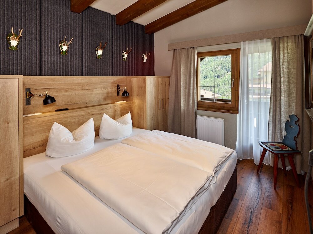 Фото A Casa Juwel - Ski in & Out Appartements