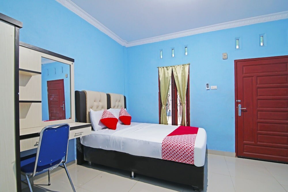 Фото Oyo 90752 Ridho Guest House Syariah