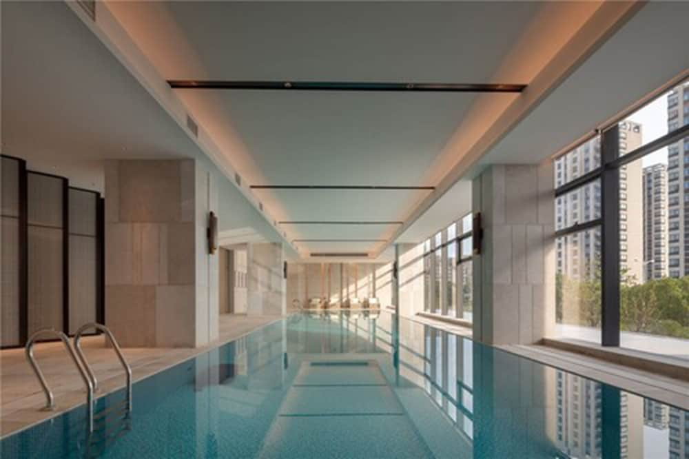 Фото New Century Hotel Zhenhai