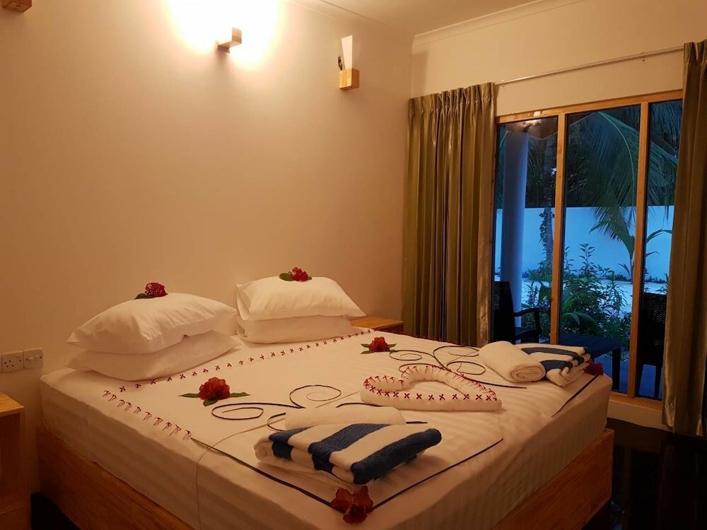 Фото Thoddoo Beach Holiday Inn