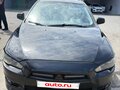 2008 Mitsubishi Lancer X, чёрный, 550000 рублей - вид 1