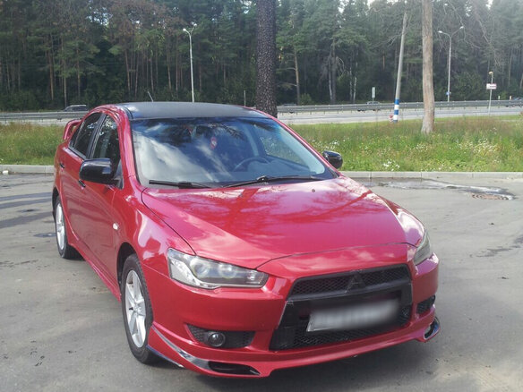 2008 Mitsubishi Lancer X, красный - вид 1