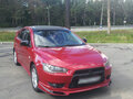2008 Mitsubishi Lancer X, красный - вид 1