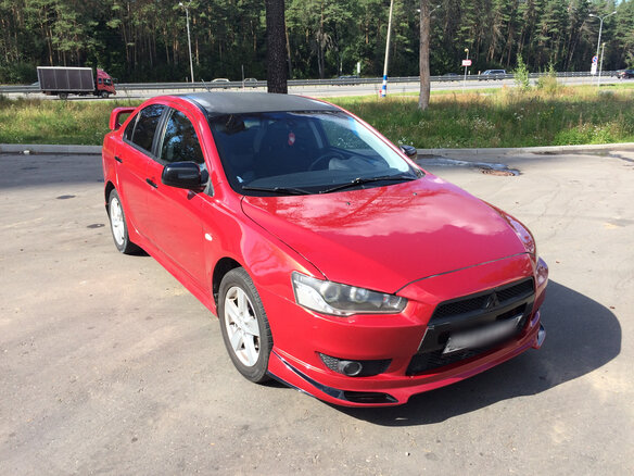 2008 Mitsubishi Lancer X, красный - вид 4