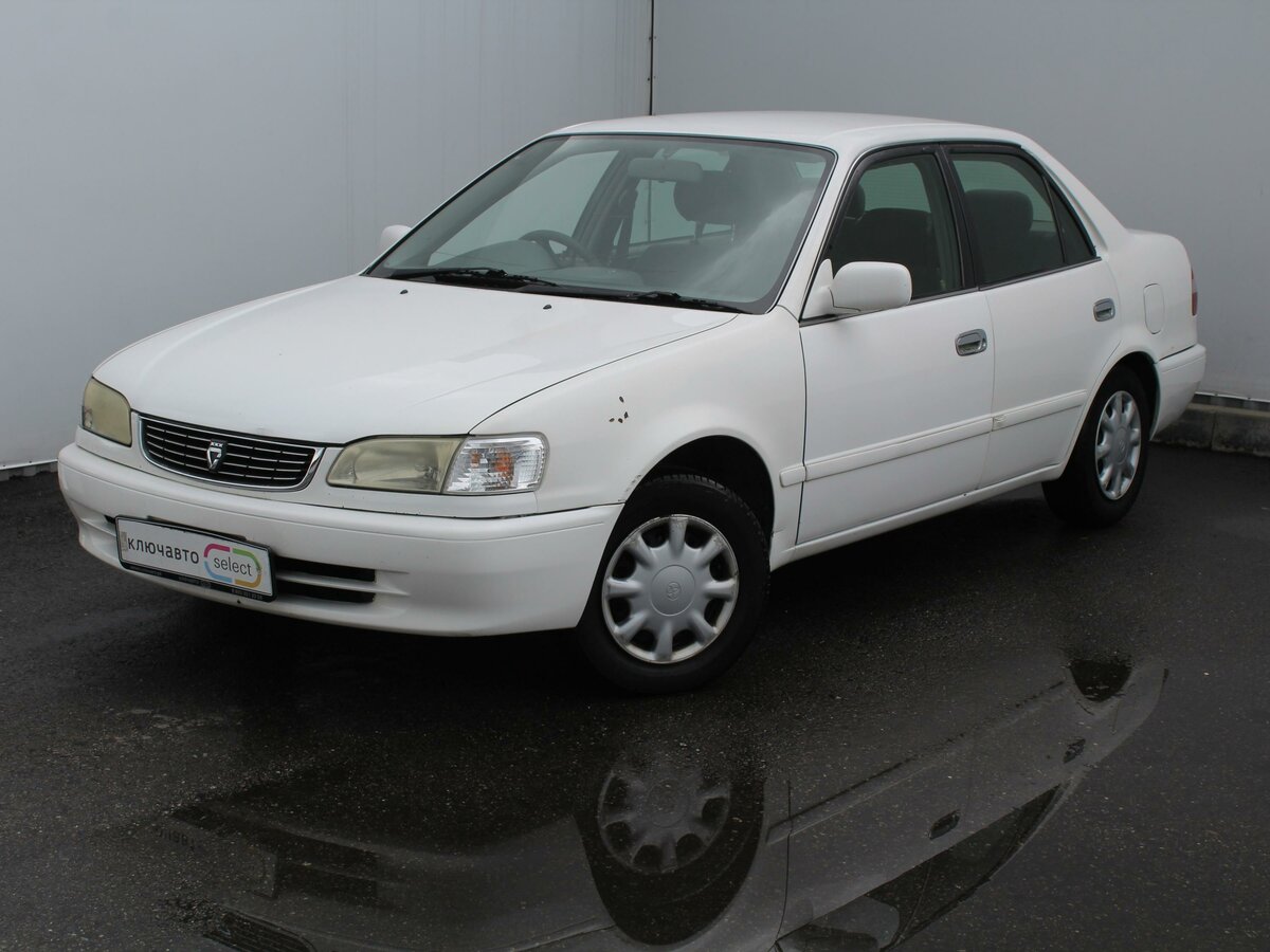 Toyota Corolla VIII (E110) 1.5 AT (100 л.с.) бензин автомат в Сочи: белый Т...