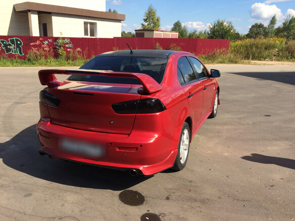 2008 Mitsubishi Lancer X, красный - вид 5