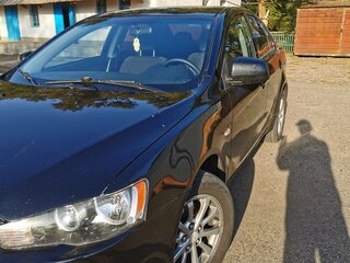 2011 Mitsubishi Lancer X Рестайлинг, чёрный, 705000 рублей, вид 1