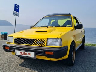1988 Nissan March I (K10), жёлтый, 400000 рублей, вид 1